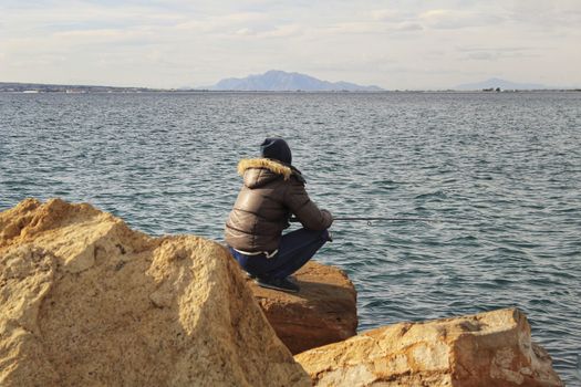 Fishing and relaxing in a sunny day in Santa Pola, Alicante