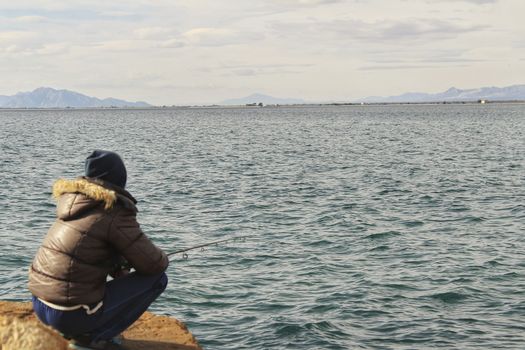 Fishing and relaxing in a sunny day in Santa Pola, Alicante