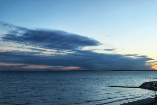 Spectacular and colorful sunset in the bay of Santa Pola, Alicante, Spain in autumn