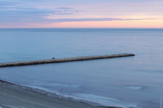 Spectacular and colorful sunset in the bay of Santa Pola, Alicante, Spain in autumn