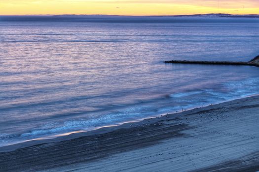 Spectacular and colorful sunset in the bay of Santa Pola, Alicante, Spain in autumn