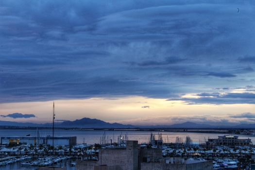 Spectacular and colorful sunset in the bay of Santa Pola, Alicante, Spain in autumn