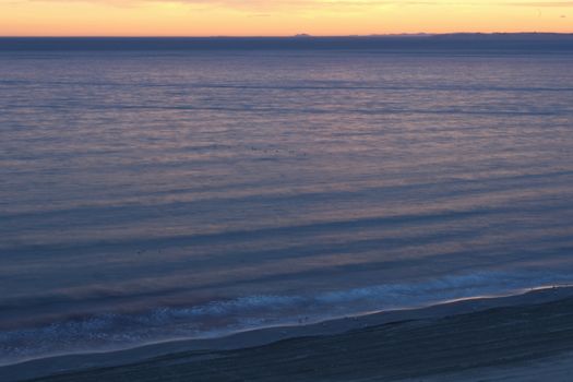 Spectacular and colorful sunset in the bay of Santa Pola, Alicante, Spain in autumn