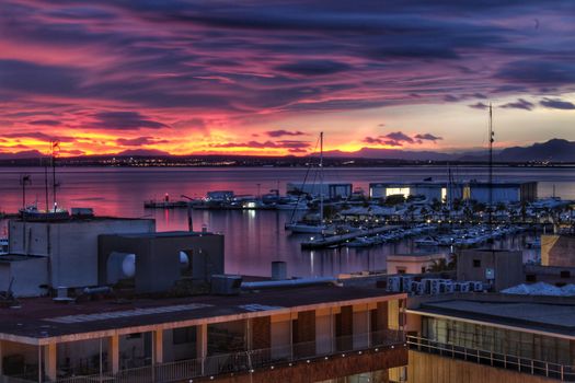 Spectacular and colorful sunset in the bay of Santa Pola, Alicante, Spain in autumn
