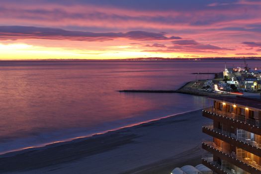 Spectacular and colorful sunset in the bay of Santa Pola, Alicante, Spain in autumn
