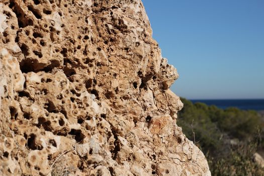 Colorful rock texture on the beach in Santa Pola, Alicante