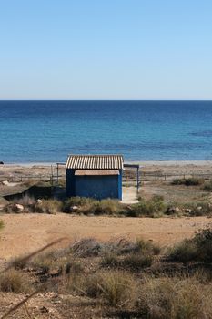 Old blue cabin on the beach in Santa Pola, Alicante