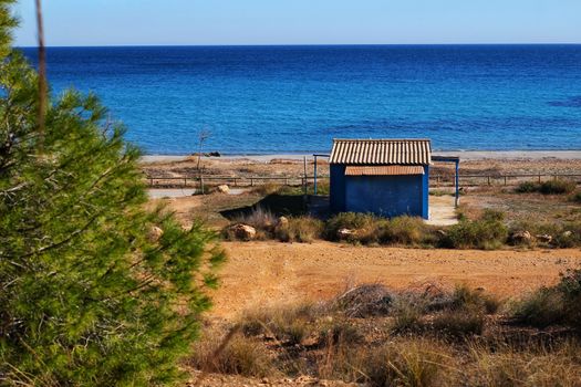 Old blue cabin on the beach in Santa Pola, Alicante