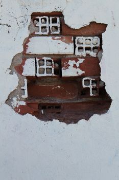 Old and damaged wall texture with windows