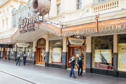 Melbourne, Australia - October 18, 2020: Victoria police patrol Melbourne CBD streets around Princess Theatre during the Coronavirus pandemic and associated lockdown.