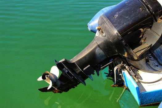 Old and powerful outboard motor in the mediterranean sea