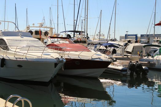 Santa Pola, Spain- 15 February, 2018: Recreational boats moored at the dock in the nautical club of Santa Pola in a sunny day