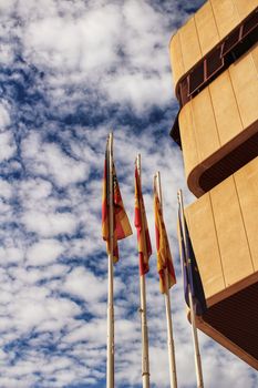 Santa Pola, Spain- February 16, 2018: Constitutional flags of Spain and Europe at the city hall in a cloudy day