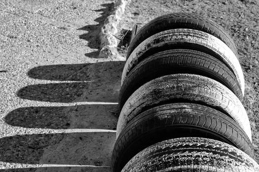 Ecological bicycle parking made with tires on the beach in Santa Pola, Spain