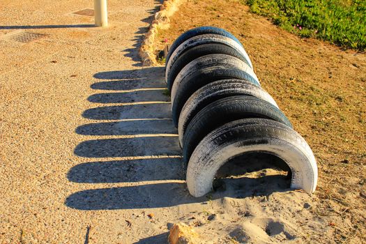 Ecological bicycle parking made with tires on the beach in Santa Pola, Spain