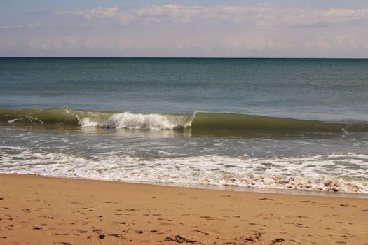 Sunny day on the beach in winter in La Marina, Alicante