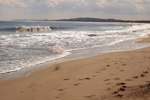 Sunny day on the beach in winter in La Marina, Alicante