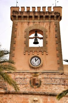 Tower and belfry of the Fortress castle of the fishing village of Santa Pola, Alicante, Spain