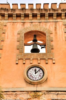 Tower and belfry of the Fortress castle of the fishing village of Santa Pola, Alicante, Spain