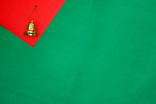 golden ring on red and green background with copy space for new year and christmas time