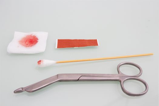 Guaze cutting scissors blood gauze ,swab and plaster on copy space