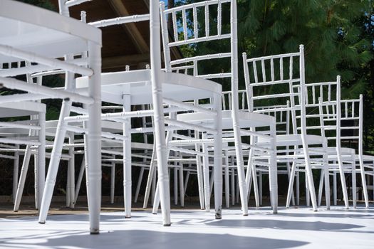 White wooden chairs for festive events. Wedding ceremony. Marriage registration.