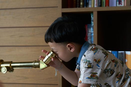 kid or boy use telescope