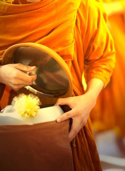 monk is offered food by buddist