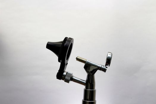 Otoscope for ENT doctor exam ear head cone piece view on white background