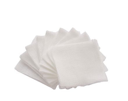 Pile of pad gauzes on isolated white background.jpg