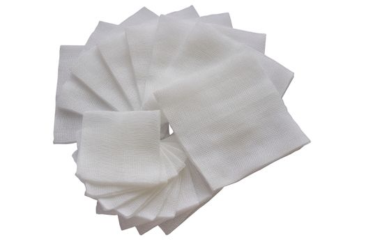 Pile of big and small size pad gauzes on isolated white background in fan shape
