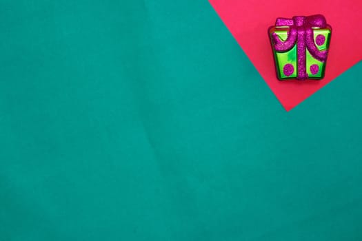 Present box on red and green background with copy space for new year and christmas time