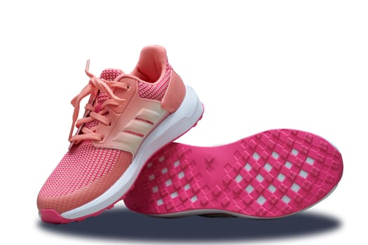 pink sport shoes with shoes sole base on white isolated background