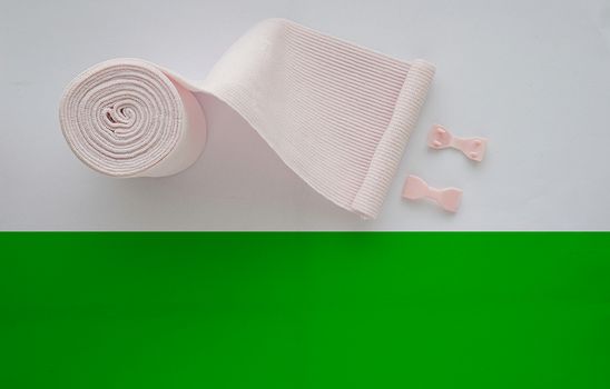 roll elastic bandage or gauze with green copy space
