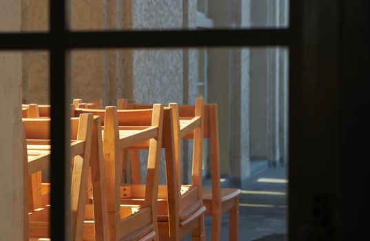 School scene with pile of study tables and chairs keep in veranda in old school time memmory concept