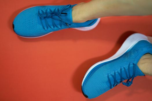running or sport shoes on feet of athlete