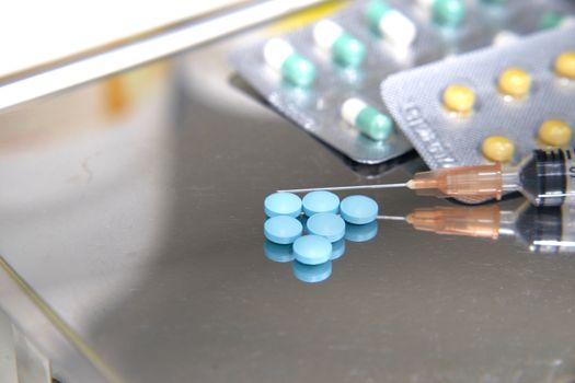 syringe and medicines on tray for counting in hospital in medical healthcare concept