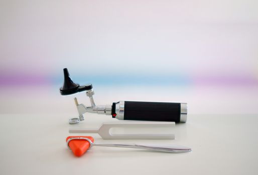 Tuning fork,Otoscope and hammer jerk on floor ,top view with copy space