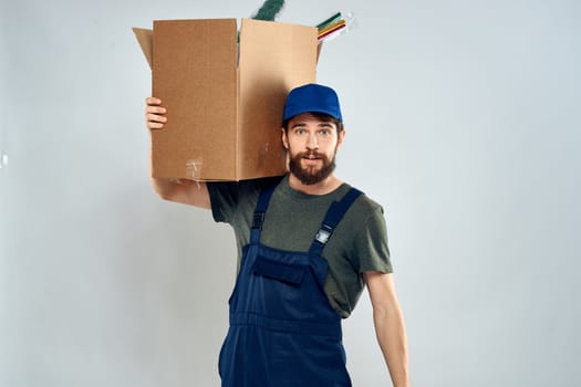 Male worker loading delivery boxes in hands packing lifestyle. High quality photo