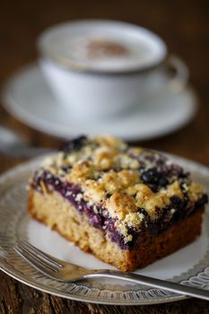 blueberry cake on dark wood