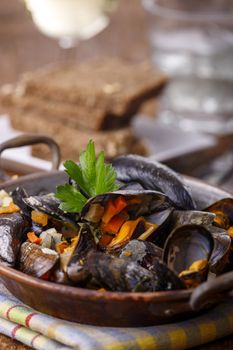 cooked mussels on dark wood