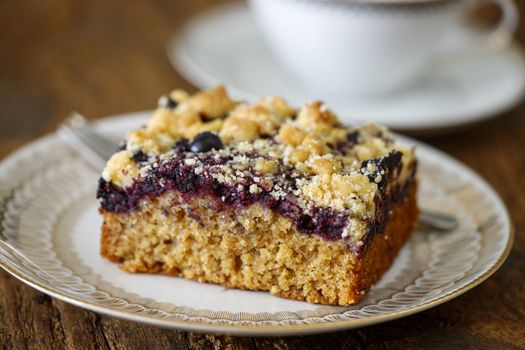 blueberry cake on dark wood