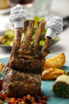 lamb ribs with frills and salad
