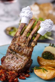 lamb ribs with frills and salad