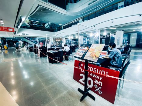 Food order booths for restaurants in shopping mall in Bangkok during COVID-19 situation. The mall adopted area during city lockdown because of coronavirus pandemic