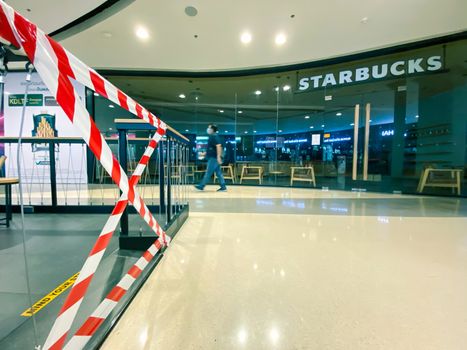 Starbucks coffee in shopping mall in Bangkok closed during COVID-19 situation. Starbucks is temporarily shuttering many shops because of the coronavirus pandemic