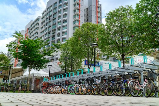 Bike parking lot at Punggol MRT/LRT station in Singapore. Punggol is planning area and new town situated on Tanjong Punggol peninsula in North-East Region of Singapore