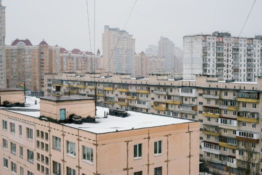 Kiev/Ukraine - February 7, 2014 - Rooftops and high residential buildings covered by snow in winter in the Obolon district of Kiev, Ukraine