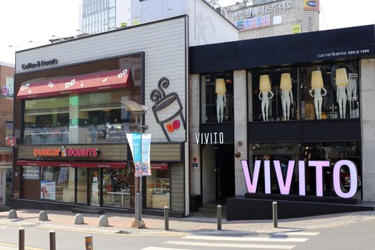 Vivito store of Carver Korea cosmetic, a beauty industry and Dunkin' Donuts shop, a coffee and doughnut company on Street Market in Ewha Womans University area.