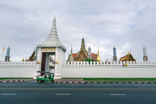 Wat Phra Kaew on cloudy day. The place is regarded as the most sacred Buddhist temple in Thailand. There is the Emerald Buddha housed in temple. Tourist destination